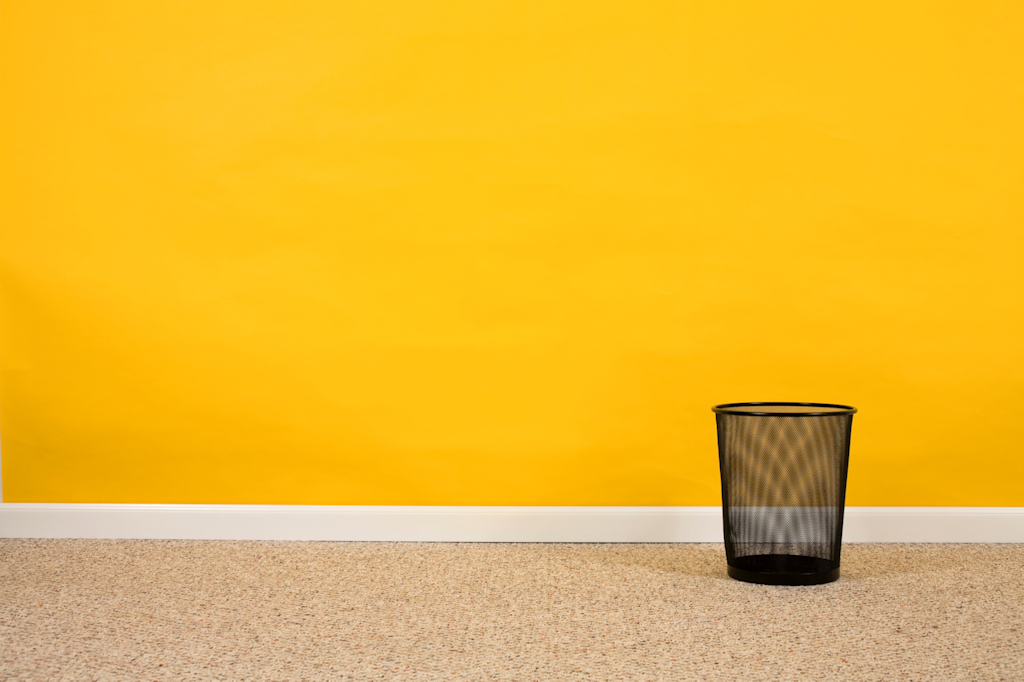 Empty black mesh waste basket.